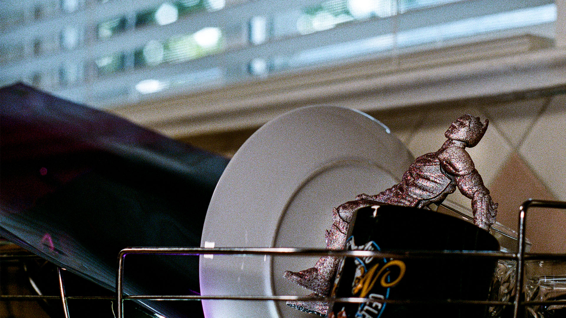 Action hero in dish rack.